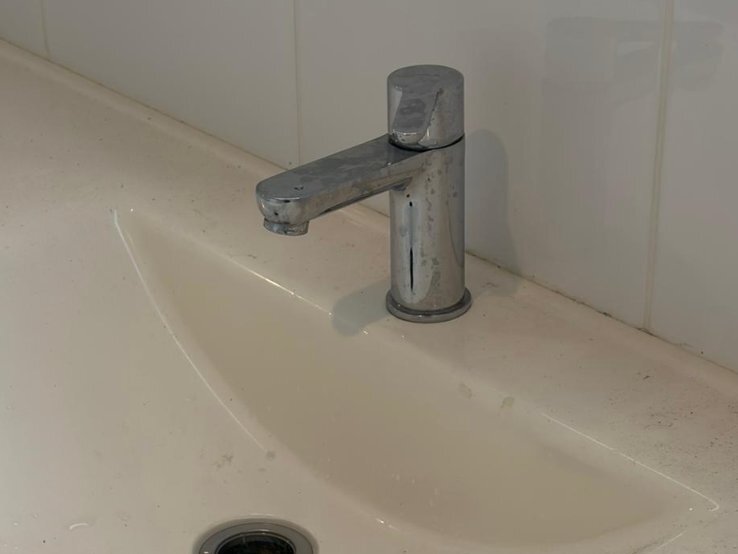 Bathroom sink before cleaning